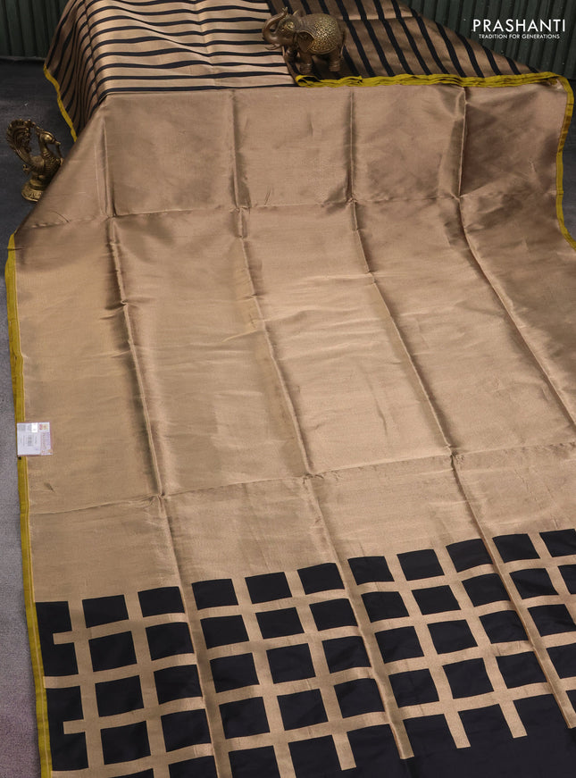 Banarasi tissue partly saree gold and black with plain body and piping border