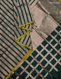 Banarasi tissue partly saree gold and green with plain body and piping border