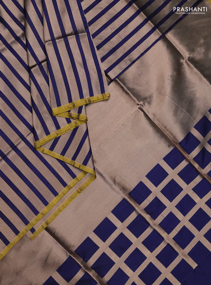 Banarasi tissue partly saree gold and navy blue with plain body and piping border