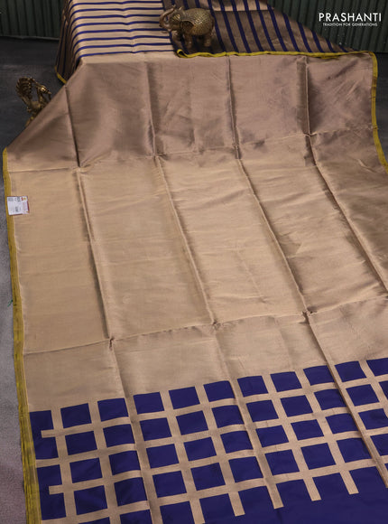 Banarasi tissue partly saree gold and navy blue with plain body and piping border