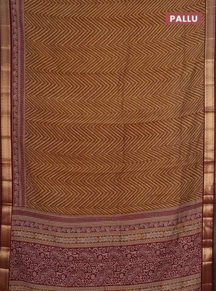Semi maheshwari cotton saree dark mustard and maroon with allover ikat prints and zari woven border