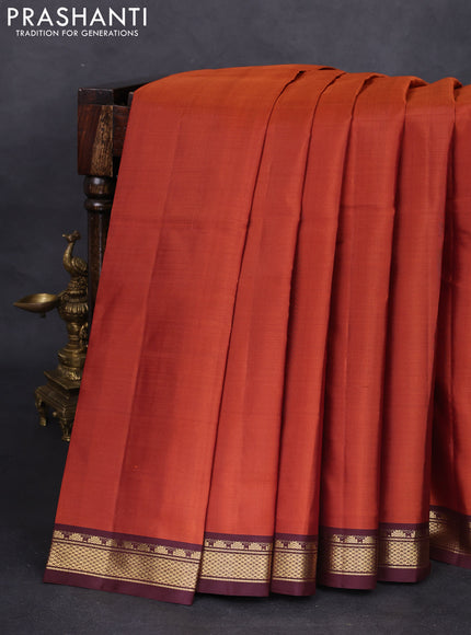 Pure kanchipuram silk saree rust shade and brown with plain body and zari woven border