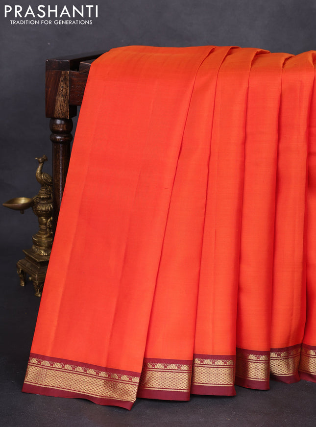 Pure kanchipuram silk saree orange and maroon with plain body and zari woven border