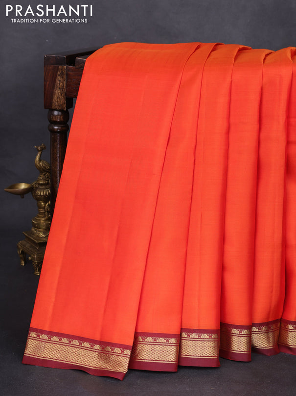 Pure kanchipuram silk saree orange and maroon with plain body and zari woven border