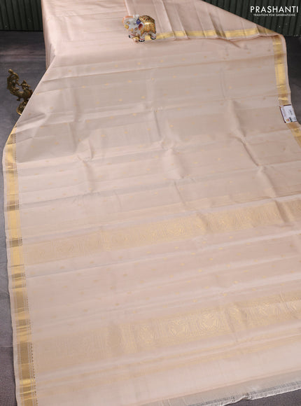 Pure kanchipuram silk saree cream with zari woven buttas and zari woven border