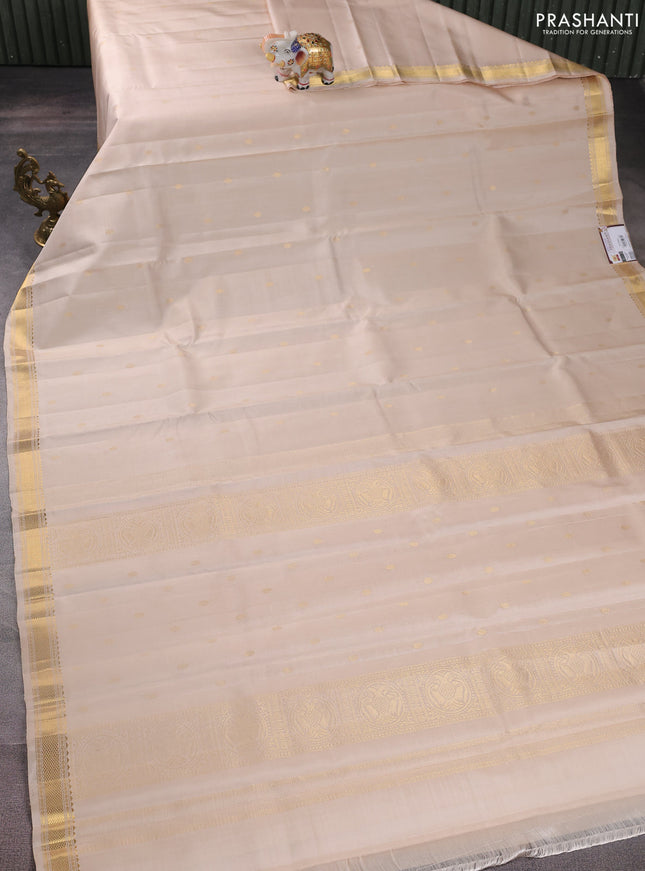 Pure kanchipuram silk saree cream with zari woven buttas and zari woven border