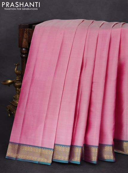 Pure kanchipuram silk saree pastel pink and peacock green with plain body and zari woven border