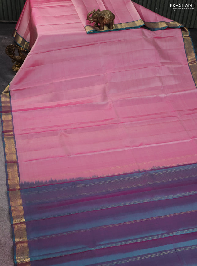 Pure kanchipuram silk saree pastel pink and peacock green with plain body and zari woven border