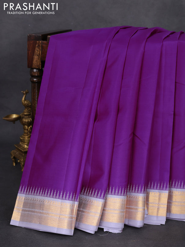 Pure kanchipuram silk saree purple and pastel grey with plain body and temple design zari woven border