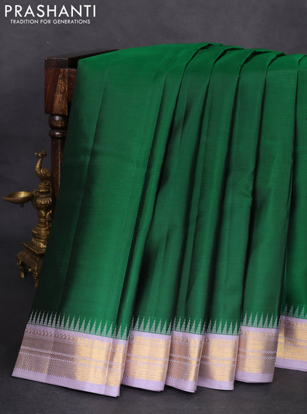 Pure kanchipuram silk saree green and pastel lavender with plain body and temple design zari woven border
