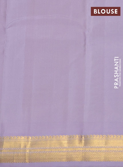 Pure kanchipuram silk saree green and pastel lavender with plain body and temple design zari woven border