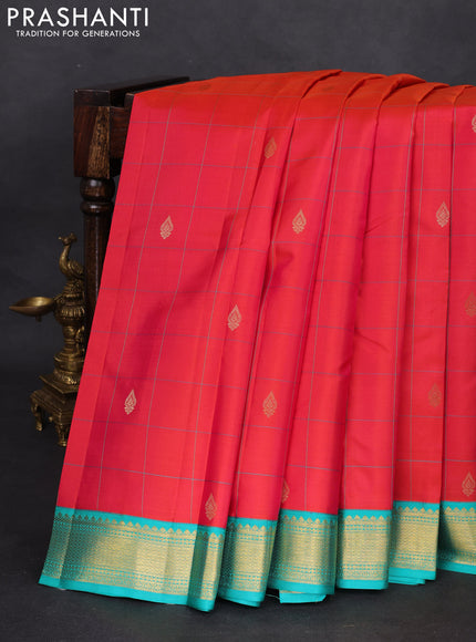 Pure kanchipuram silk saree dual shade of pinkish orange and teal blue with allover checks & zari buttas and zari woven korvai border