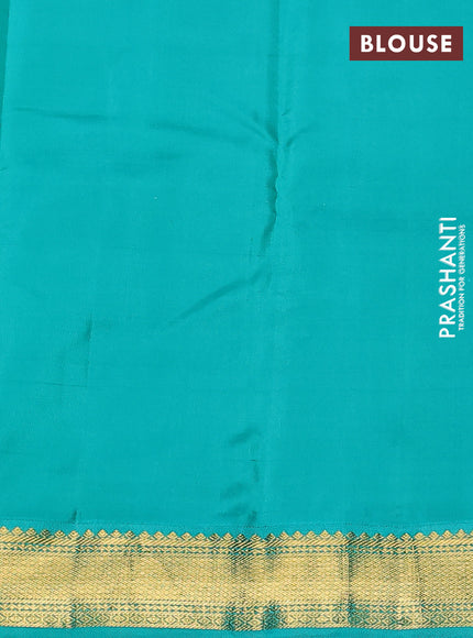 Pure kanchipuram silk saree dual shade of pinkish orange and teal blue with allover checks & zari buttas and zari woven korvai border