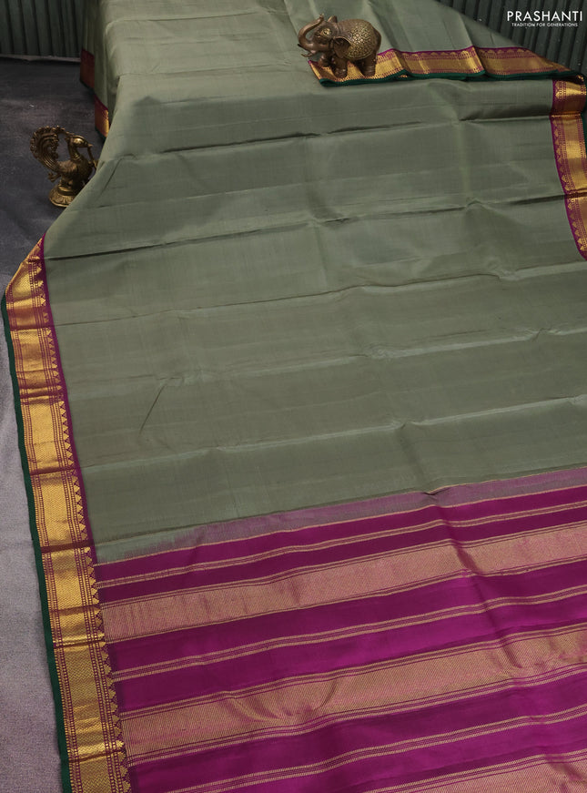 Pure kanchipuram silk saree greyish green and purple with plain body and zari woven korvai border