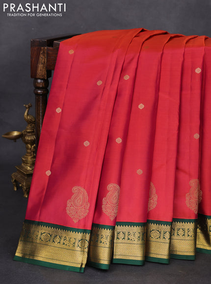 Pure kanchipuram silk saree dual shade of pinkish orange and green with zari woven buttas and zari woven korvai border