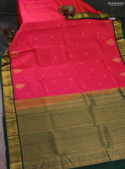 Pure kanchipuram silk saree dual shade of pinkish orange and dark green with zari woven buttas and zari woven korvai border