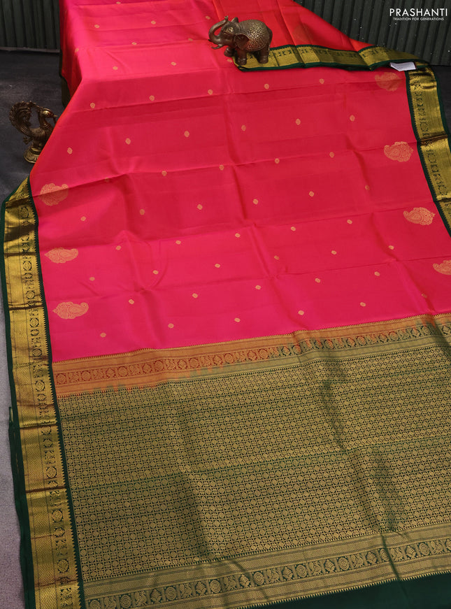 Pure kanchipuram silk saree dual shade of pinkish orange and dark green with zari woven buttas and zari woven korvai border