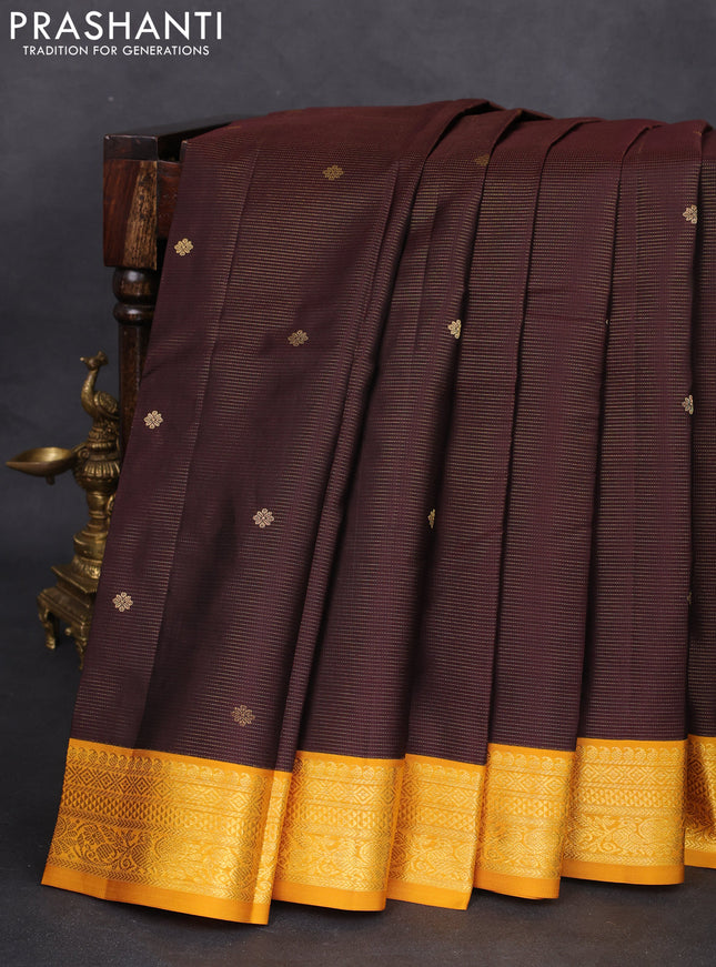 Pure kanchipuram silk saree brown and mustard yellow with allover zari weaves & buttas and zari woven korvai border