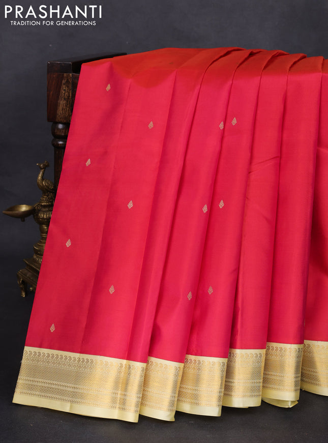 Pure kanchipuram silk saree reddish pink and pale yellow with zari woven buttas and zari woven korvai border