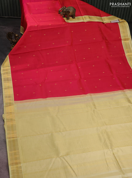 Pure kanchipuram silk saree reddish pink and pale yellow with zari woven buttas and zari woven korvai border