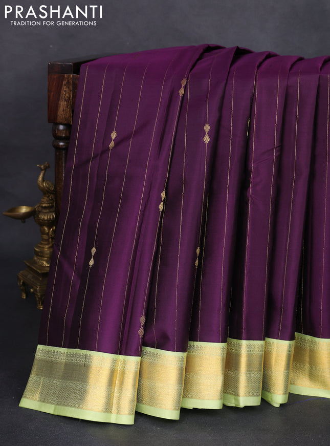 Pure kanchipuram silk saree deep purple and pista green with allover zari weaves and zari woven korvai border