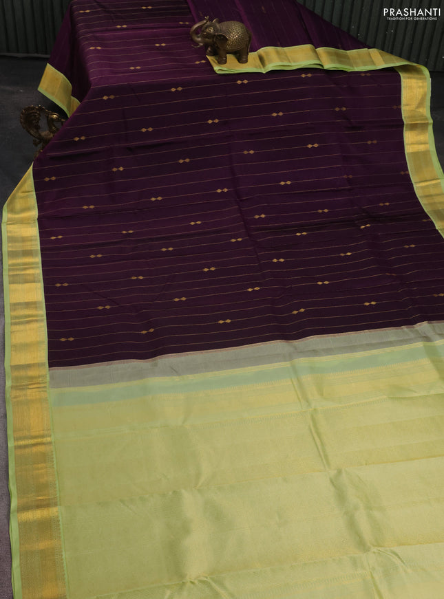 Pure kanchipuram silk saree deep purple and pista green with allover zari weaves and zari woven korvai border