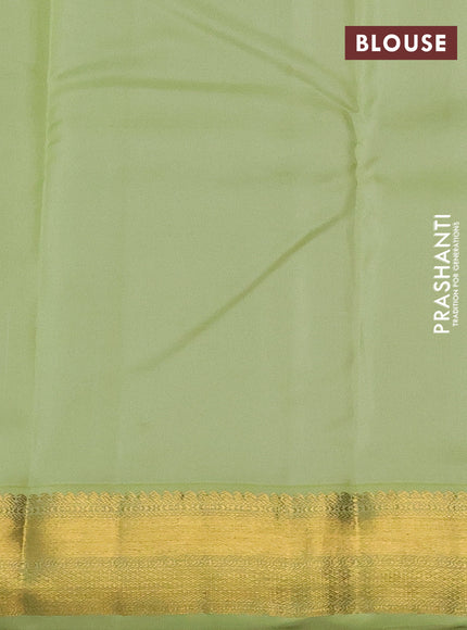 Pure kanchipuram silk saree deep purple and pista green with allover zari weaves and zari woven korvai border
