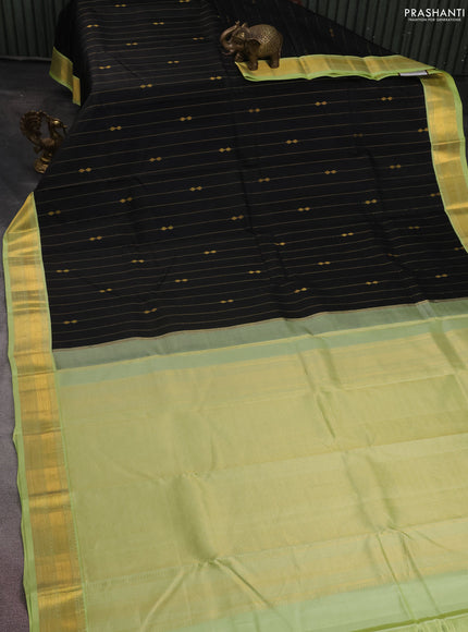 Pure kanchipuram silk saree black and pista green with allover zari weaves and zari woven korvai border
