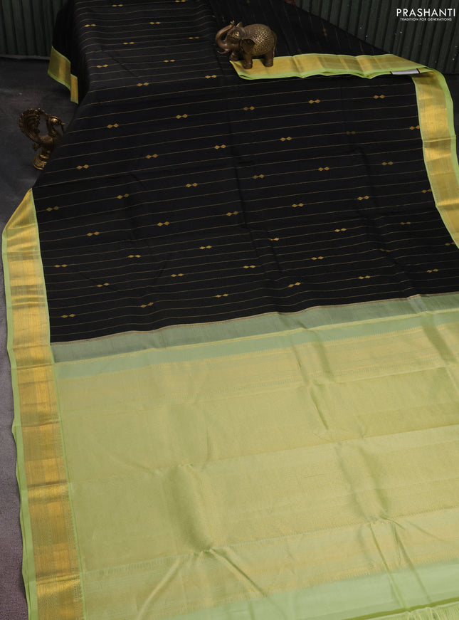 Pure kanchipuram silk saree black and pista green with allover zari weaves and zari woven korvai border