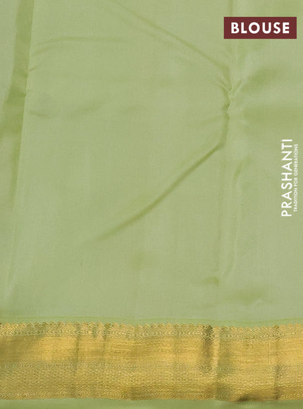 Pure kanchipuram silk saree black and pista green with allover zari weaves and zari woven korvai border