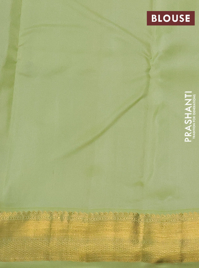 Pure kanchipuram silk saree black and pista green with allover zari weaves and zari woven korvai border