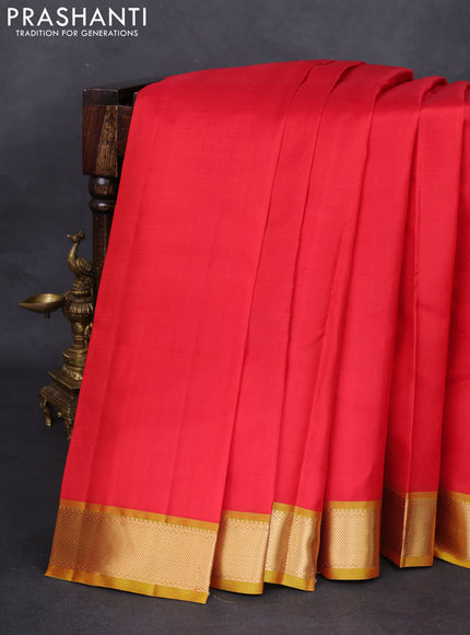 Pure kanchipuram silk saree red and mustard shade with plain body and zari woven border