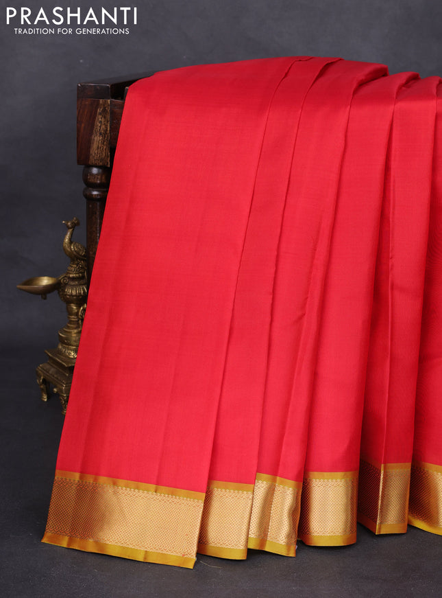 Pure kanchipuram silk saree red and mustard shade with plain body and zari woven border