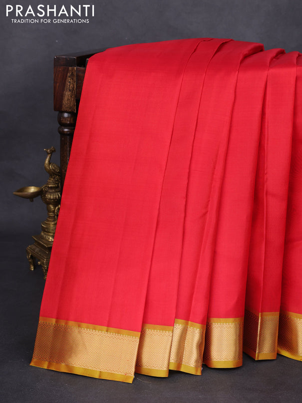 Pure kanchipuram silk saree red and mustard shade with plain body and zari woven border