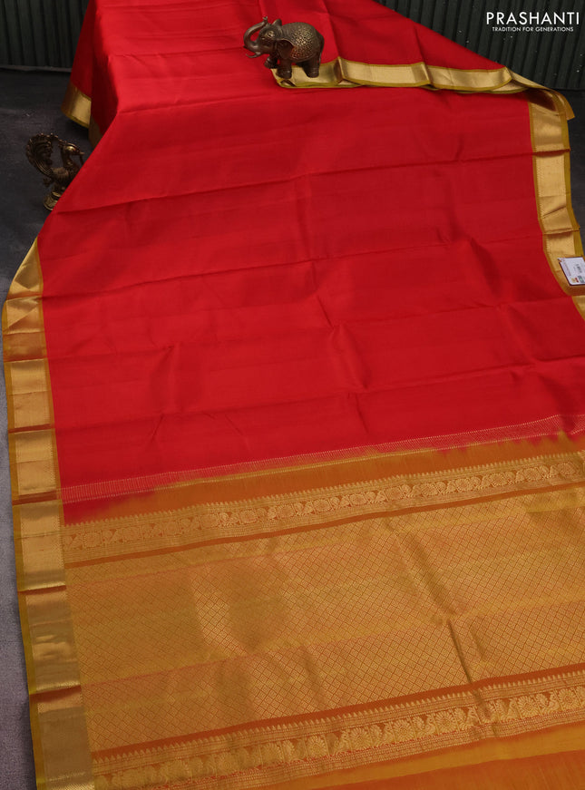 Pure kanchipuram silk saree red and mustard shade with plain body and zari woven border