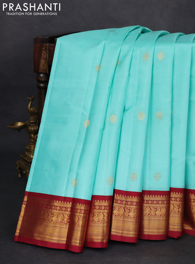 Pure kanchipuram silk saree teal blue and maroon with zari woven buttas and zari woven korvai border