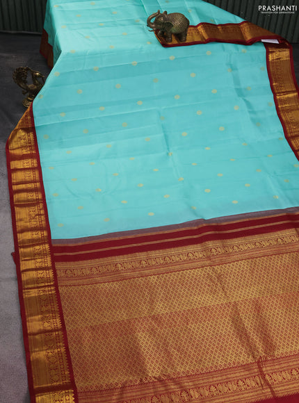 Pure kanchipuram silk saree teal blue and maroon with zari woven buttas and zari woven korvai border