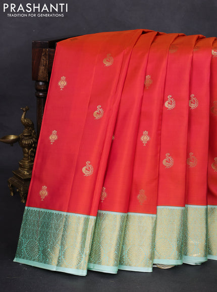 Pure kanchipuram silk saree dual shade of pinkish orange and green shade with zari woven buttas and zari woven korvai border