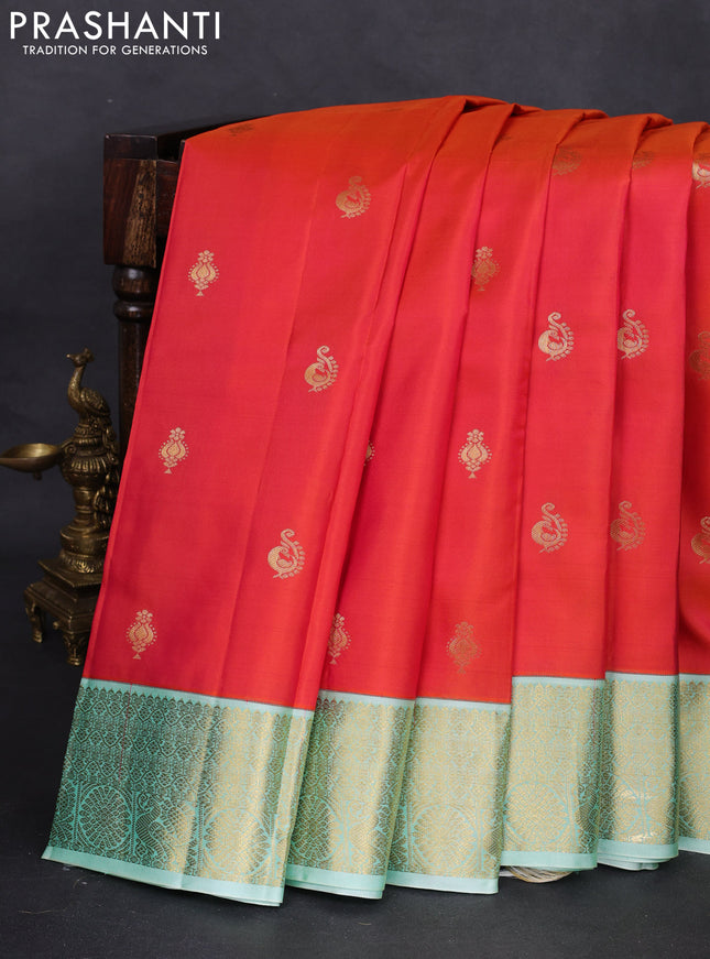 Pure kanchipuram silk saree dual shade of pinkish orange and green shade with zari woven buttas and zari woven korvai border