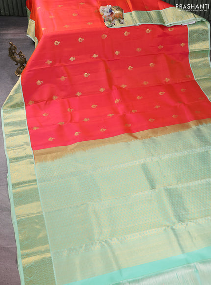 Pure kanchipuram silk saree dual shade of pinkish orange and green shade with zari woven buttas and zari woven korvai border