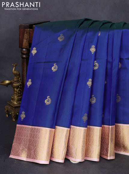 Pure kanchipuram silk saree dual shade of bluish green and peach shade with zari woven buttas and zari woven korvai border
