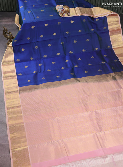 Pure kanchipuram silk saree dual shade of bluish green and peach shade with zari woven buttas and zari woven korvai border