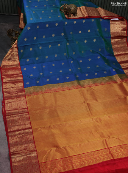 Pure kanchipuram silk saree dual shade of bluish green and maroon with zari woven buttas and zari woven korvai border