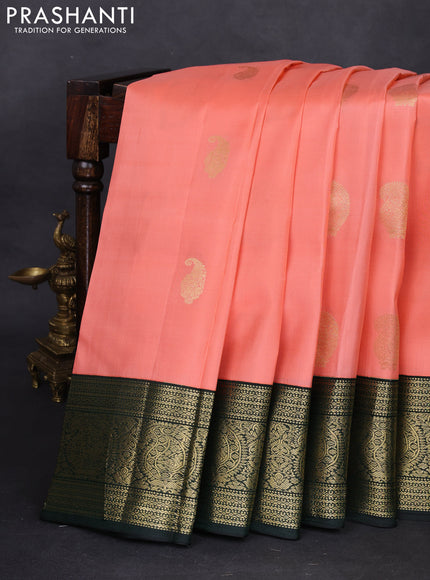 Pure kanchipuram silk saree peach shade and dark bottle green with zari woven buttas and zari woven korvai border