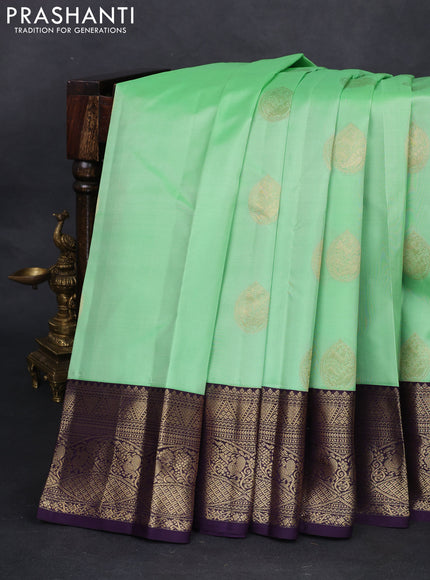 Pure kanchipuram silk saree pista green and deep jamun with zari woven buttas and zari woven korvai border