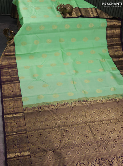 Pure kanchipuram silk saree pista green and deep jamun with zari woven buttas and zari woven korvai border