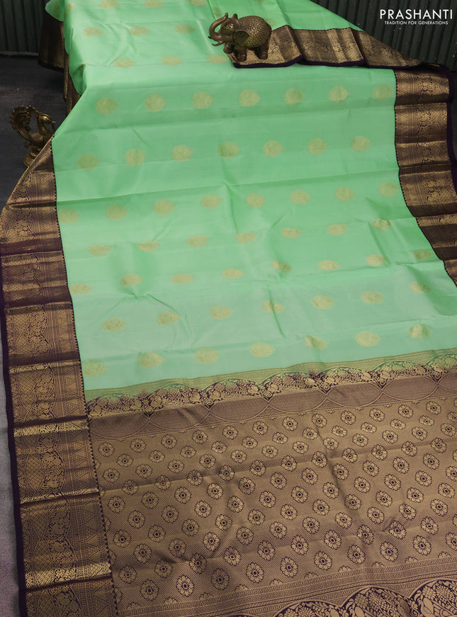 Pure kanchipuram silk saree pista green and deep jamun with zari woven buttas and zari woven korvai border