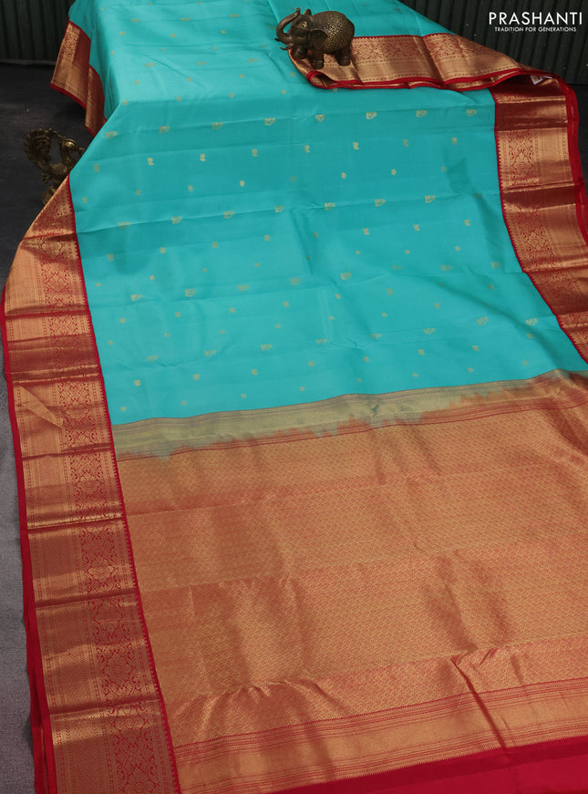 Pure kanchipuram silk saree teal blue and reddish pink with zari woven buttas and zari woven korvai border
