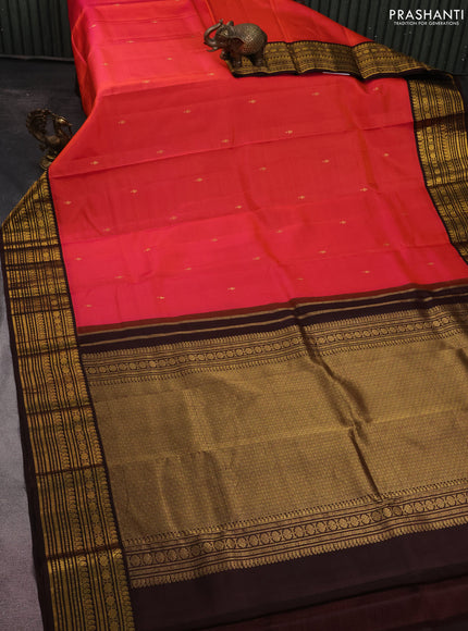 Pure kanchipuram silk saree dual shade  of pinkish orange and brown with zari woven buttas and zari woven korvai border