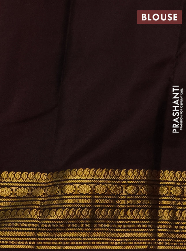 Pure kanchipuram silk saree dual shade  of pinkish orange and brown with zari woven buttas and zari woven korvai border